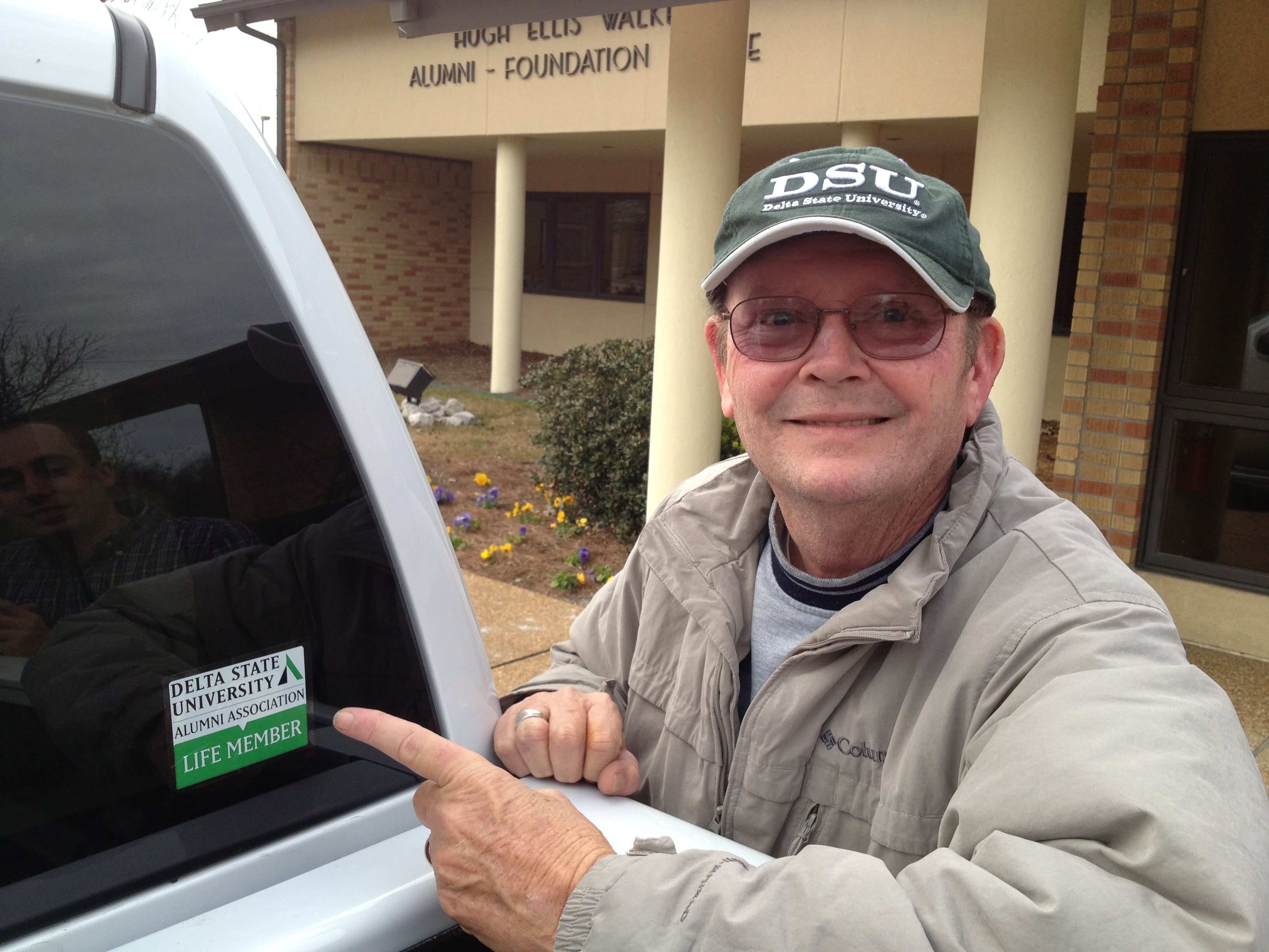 Photo: James Donald Cooper (’63), Registrar Emeritus, shows off his DSU Alumni Association Life Member Decal.